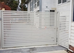 white closed fence - side of house