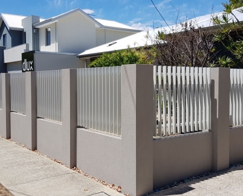 brown fence with white pickets