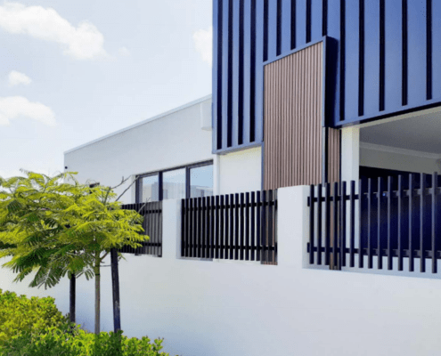 house with steel fence wall