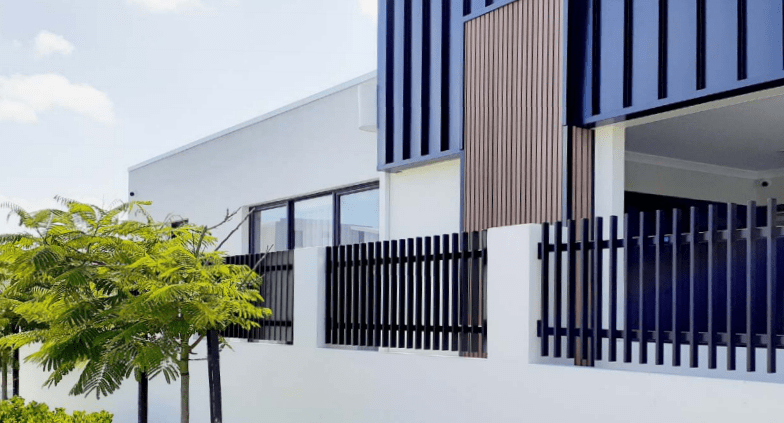 house with steel fence wall