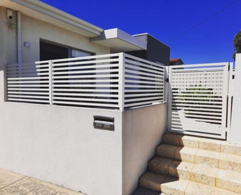 White wall with slat fencing