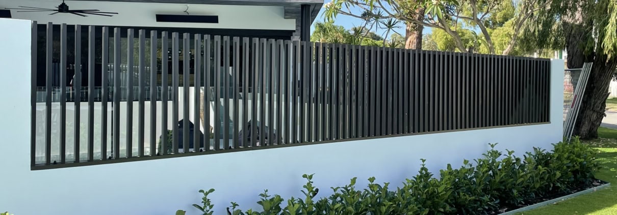 A photo of a house with batten fencing installed at the front.