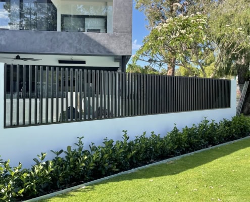 A photo of a house with batten fencing installed at the front.