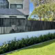 A photo of a house with batten fencing installed at the front.